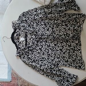 Flared sleeve mesh top with a ruffle front